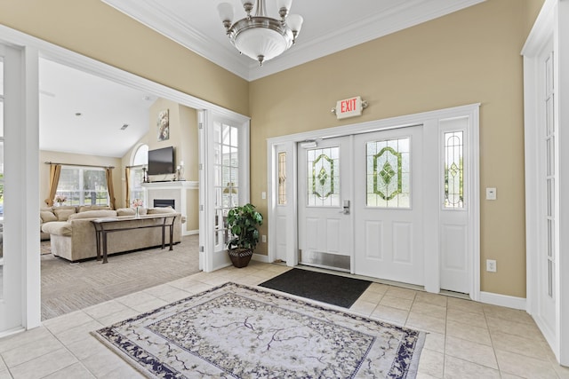 200 Jamie Lynn Cir, Pickerington, OH 43147 - foyer featuring light tile patterned flooring, baseboards, ornamental molding, a fireplace, and a chandelier