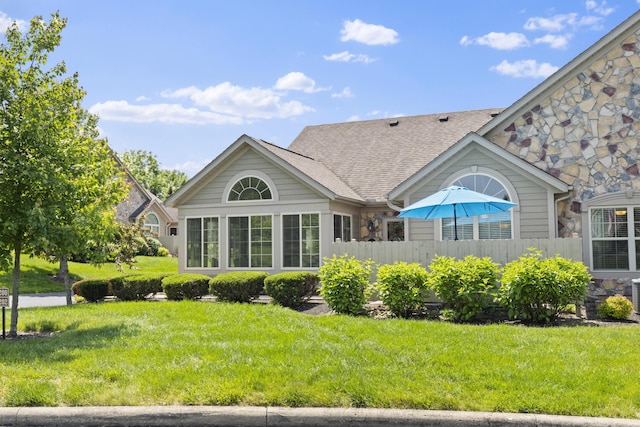 200 Jamie Lynn Cir, Pickerington, OH 43147 - back of property featuring stone siding and a shingled roof