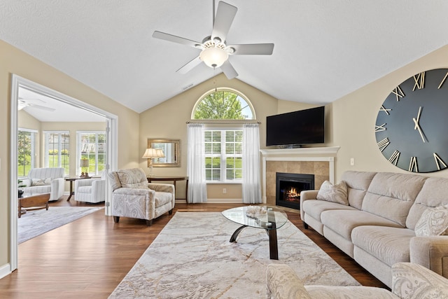 200 Jamie Lynn Cir, Pickerington, OH 43147 - living room featuring a ceiling fan, lofted ceiling, a tiled fireplace, and dark wood-style floors