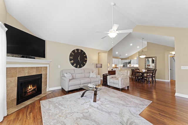 200 Jamie Lynn Cir, Pickerington, OH 43147 - living area with a ceiling fan, wood finished floors, a fireplace, baseboards, and high vaulted ceiling