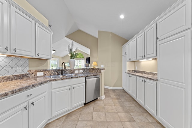 200 Jamie Lynn Cir, Pickerington, OH 43147 - kitchen featuring stainless steel dishwasher, a sink, vaulted ceiling, white cabinetry, and tasteful backsplash
