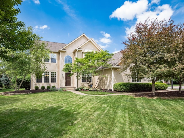 6810 Bearclover Dr, Dublin, OH 43016 - view of front of house with stucco siding and a front yard