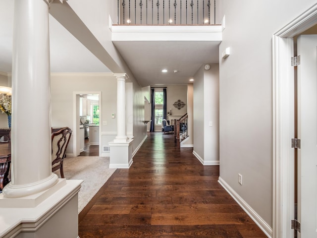 6810 Bearclover Dr, Dublin, OH 43016 - foyer featuring ornate columns, baseboards, dark wood-type flooring, crown molding, and recessed lighting