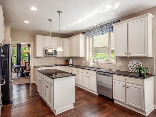 6810 Bearclover Dr, Dublin, OH 43016 - kitchen featuring appliances with stainless steel finishes, a sink, white cabinetry, and recessed lighting