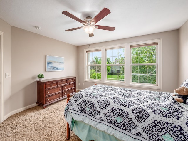 6810 Bearclover Dr, Dublin, OH 43016 - bedroom with baseboards, light colored carpet, and a ceiling fan