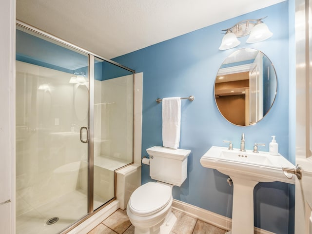 6810 Bearclover Dr, Dublin, OH 43016 - bathroom featuring toilet, a stall shower, and baseboards