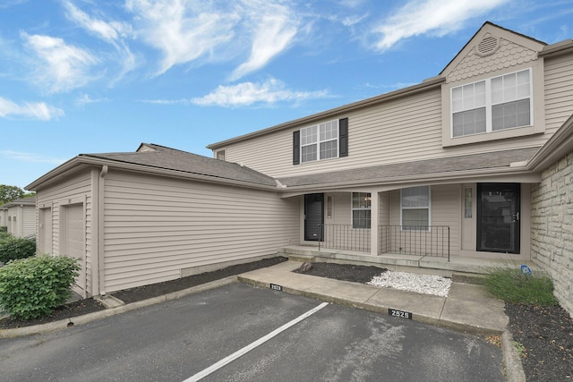 2523 Dahlia Way Unit 63B, Columbus, OH 43235 - view of front of house with covered porch and uncovered parking