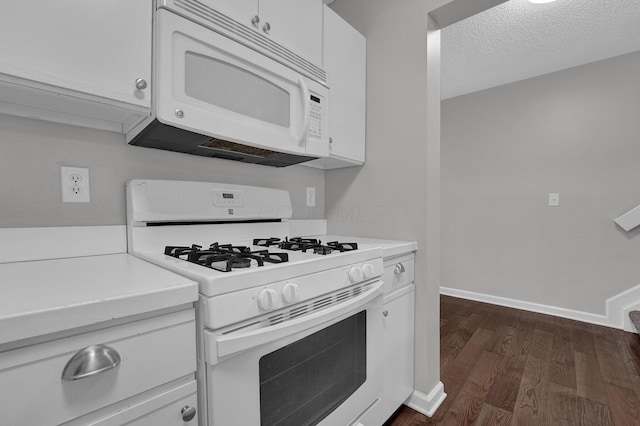 2523 Dahlia Way Unit 63B, Columbus, OH 43235 - kitchen featuring white appliances, dark wood-style flooring, light countertops, white cabinetry, and a textured ceiling