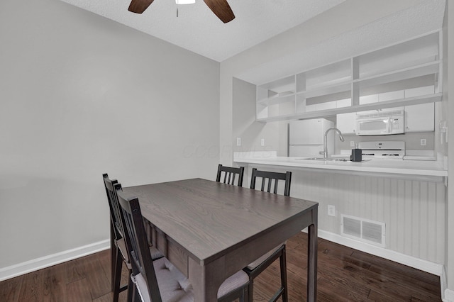 2523 Dahlia Way Unit 63B, Columbus, OH 43235 - dining room with baseboards, wood finished floors, and ceiling fan