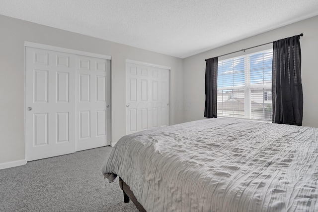 2523 Dahlia Way Unit 63B, Columbus, OH 43235 - carpeted bedroom with a textured ceiling and baseboards