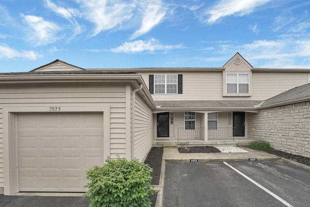 2523 Dahlia Way Unit 63B, Columbus, OH 43235 - view of front facade featuring covered porch