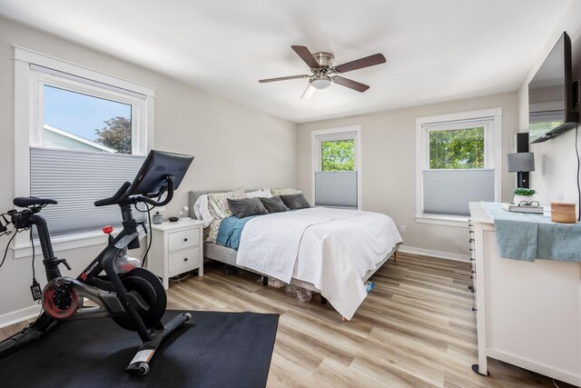 5999 Waterview Dr, Hilliard, OH 43026 - bedroom featuring light wood-type flooring, baseboards, and a ceiling fan