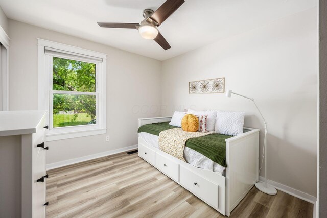5999 Waterview Dr, Hilliard, OH 43026 - bedroom with light wood-type flooring, baseboards, and a ceiling fan