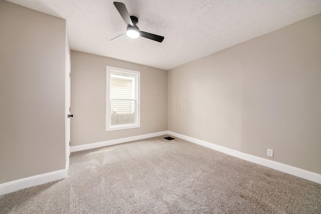 960 Carpenter St, Columbus, OH 43206 - spare room featuring a ceiling fan, carpet flooring, baseboards, and a textured ceiling