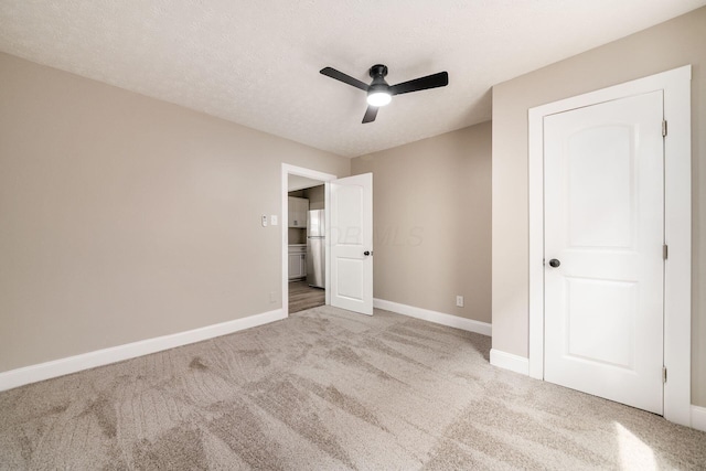 960 Carpenter St, Columbus, OH 43206 - unfurnished bedroom with carpet floors, baseboards, and a ceiling fan