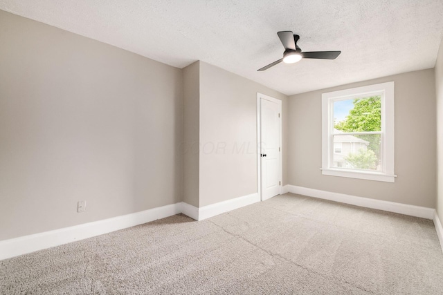 960 Carpenter St, Columbus, OH 43206 - carpeted spare room featuring baseboards, a textured ceiling, and a ceiling fan