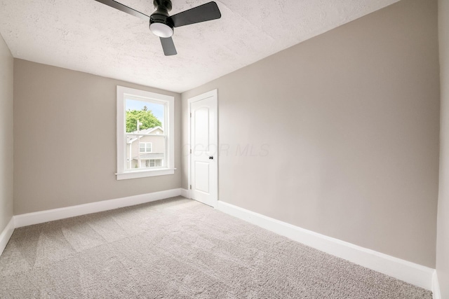 960 Carpenter St, Columbus, OH 43206 - carpeted spare room with a textured ceiling, baseboards, and a ceiling fan