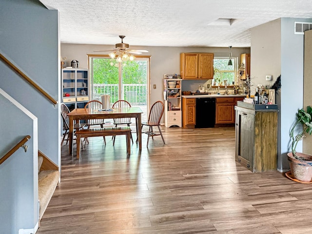 4890 Township Road 138 NW, Somerset, OH 43783 - dining area featuring plenty of natural light, ceiling fan, light wood-style flooring, stairs, and a textured ceiling