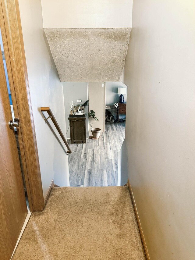 4890 Township Road 138 NW, Somerset, OH 43783 - stairway featuring a textured ceiling and wood finished floors
