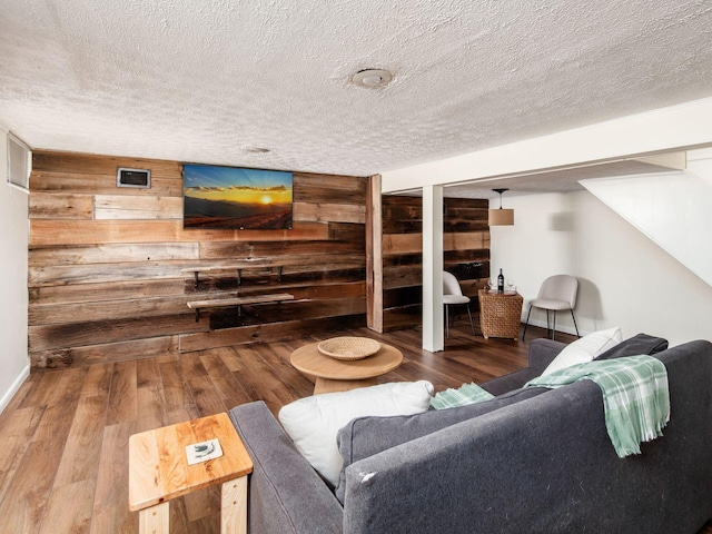 2805 Brandon Rd, Upper Arlington, OH 43221 - living room featuring wood finished floors, wooden walls, a textured ceiling, and baseboards