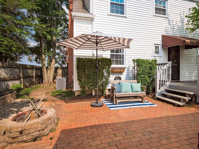2805 Brandon Rd, Upper Arlington, OH 43221 - fenced backyard with a patio area, central AC unit, and an outdoor living space with a fire pit