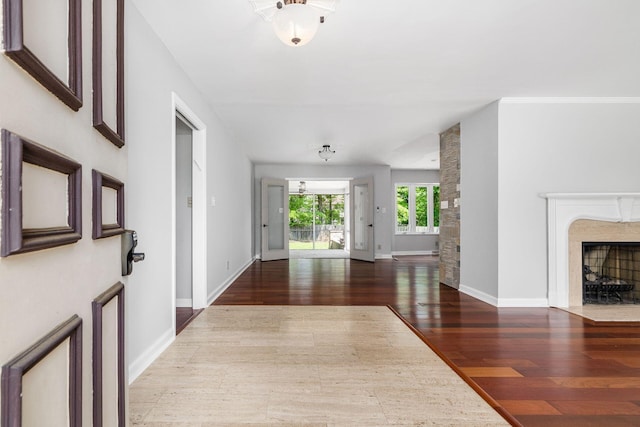 337 Naiche Ct, Columbus, OH 43213 - foyer entrance featuring a premium fireplace and wood finished floors