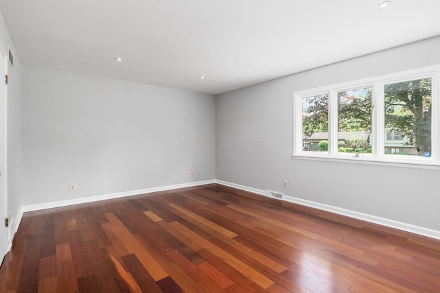337 Naiche Ct, Columbus, OH 43213 - empty room featuring plenty of natural light, dark wood-type flooring, and recessed lighting