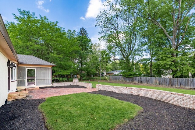 337 Naiche Ct, Columbus, OH 43213 - view of yard with a sunroom and a patio area