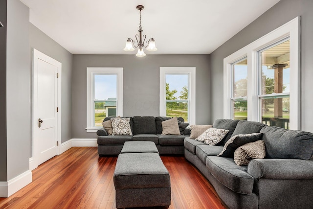 2174 Peachblow Rd, Lewis Center, OH 43035 - living area with dark wood-type flooring, healthy amount of natural light, a chandelier, and baseboards