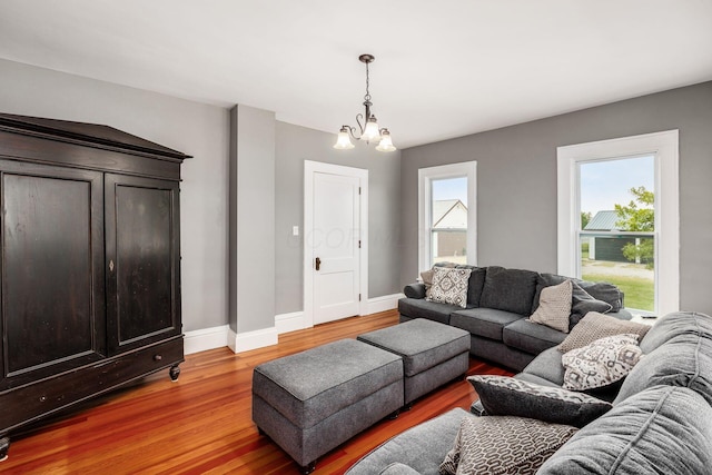 2174 Peachblow Rd, Lewis Center, OH 43035 - living room with light wood-style flooring, a chandelier, and baseboards