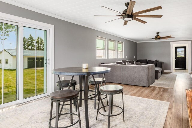 2174 Peachblow Rd, Lewis Center, OH 43035 - dining space featuring ornamental molding, a ceiling fan, wood finished floors, and baseboards
