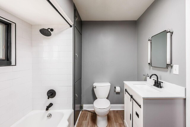 2174 Peachblow Rd, Lewis Center, OH 43035 - full bathroom featuring vanity, toilet, wood finished floors, bathing tub / shower combination, and baseboards
