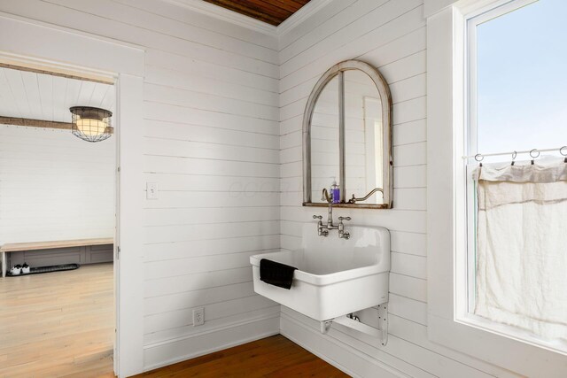 2174 Peachblow Rd, Lewis Center, OH 43035 - bathroom with wood finished floors, crown molding, and wood walls