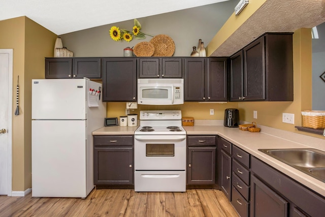 5191 Upland Meadow Dr, Canal Winchester, OH 43110 - kitchen with white appliances, light wood-type flooring, light countertops, and dark brown cabinetry