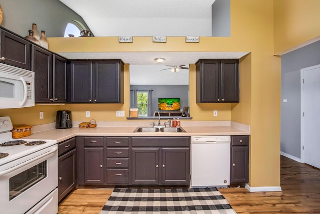 5191 Upland Meadow Dr, Canal Winchester, OH 43110 - kitchen featuring white appliances, a sink, light wood-type flooring, light countertops, and dark brown cabinetry