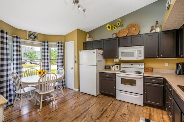 5191 Upland Meadow Dr, Canal Winchester, OH 43110 - kitchen featuring white appliances, light countertops, light wood-style flooring, vaulted ceiling, and dark brown cabinetry