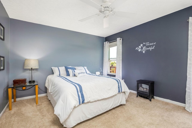5191 Upland Meadow Dr, Canal Winchester, OH 43110 - bedroom featuring a wood stove, carpet floors, baseboards, and a ceiling fan
