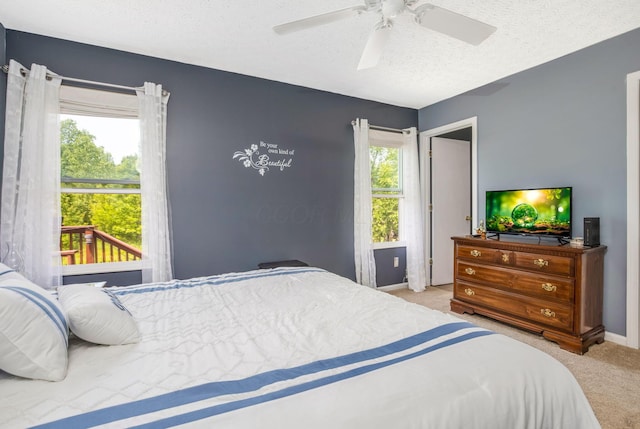5191 Upland Meadow Dr, Canal Winchester, OH 43110 - carpeted bedroom with baseboards, a textured ceiling, and ceiling fan