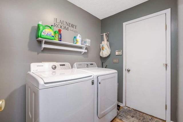 5191 Upland Meadow Dr, Canal Winchester, OH 43110 - laundry room with independent washer and dryer, light wood-style floors, and a textured ceiling