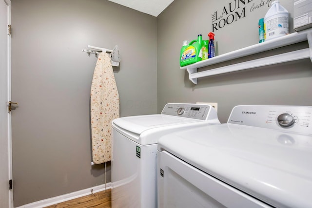 5191 Upland Meadow Dr, Canal Winchester, OH 43110 - washroom featuring separate washer and dryer, baseboards, and wood finished floors