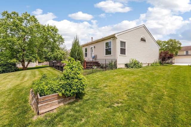 5191 Upland Meadow Dr, Canal Winchester, OH 43110 - back of house featuring a vegetable garden