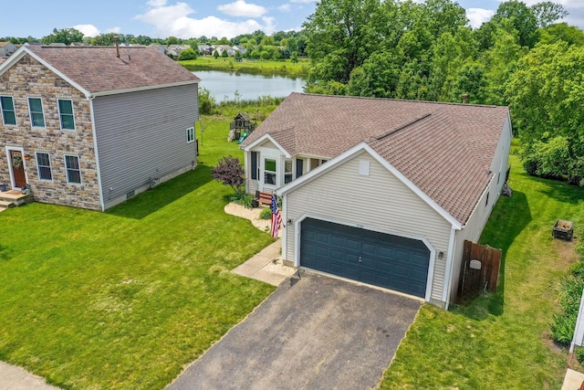 5191 Upland Meadow Dr, Canal Winchester, OH 43110 - view of front of house with a water view, driveway, an attached garage, and a front yard