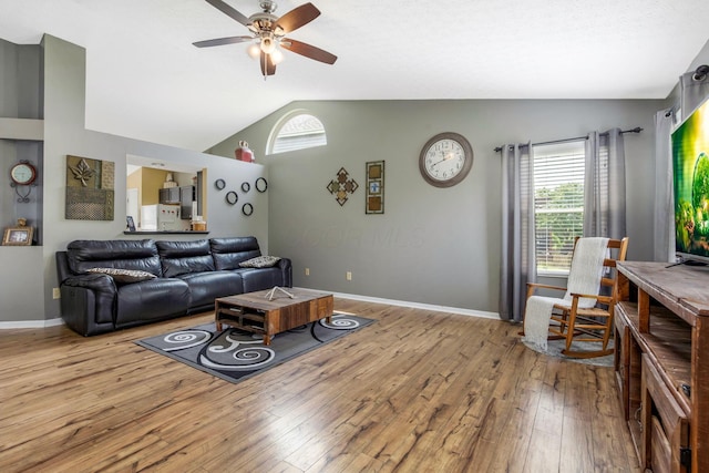 5191 Upland Meadow Dr, Canal Winchester, OH 43110 - living room with vaulted ceiling, light wood-style floors, a ceiling fan, and baseboards