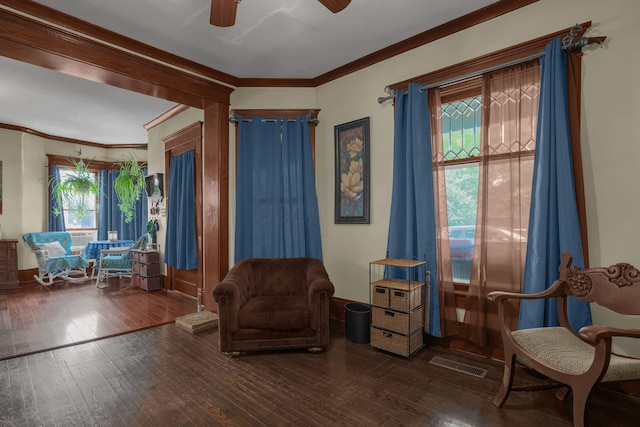132 Orange St, Galion, OH 44833 - living area featuring hardwood / wood-style flooring, ceiling fan, crown molding, and baseboards