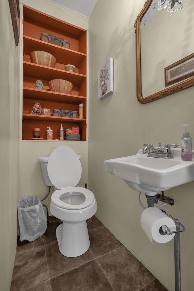 132 Orange St, Galion, OH 44833 - half bathroom featuring toilet, tile patterned flooring, and built in features