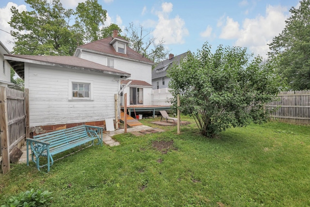 132 Orange St, Galion, OH 44833 - rear view of house with a deck, a chimney, and a shingled roof