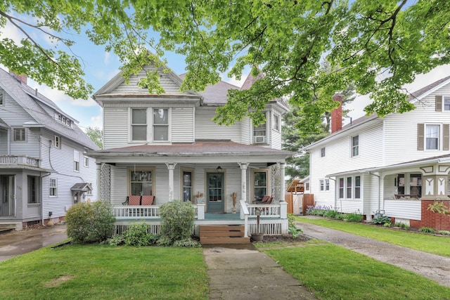 132 Orange St, Galion, OH 44833 - view of front facade featuring covered porch and a front lawn