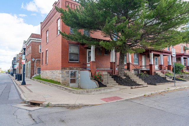 2 E Blake Ave, Columbus, OH 43202 - view of front of home featuring brick siding and a porch