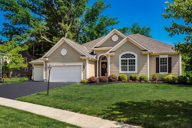 340 Olentangy W, Delaware, OH 43015 - view of front of property with driveway, a garage, a front yard, and a shingled roof