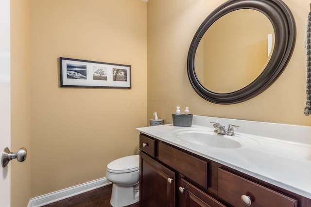 340 Olentangy W, Delaware, OH 43015 - bathroom with vanity, wood finished floors, toilet, and baseboards